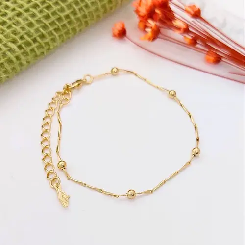 PULSEIRA ESFERAS DO SOL BANHADA A OURO 18K