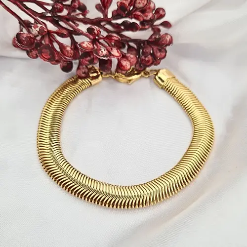 PULSEIRA MALHA GROSSA BANHADA A OURO 18K