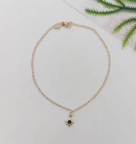 TORNOZELEIRA ESTRELA ESMERALDA BANHADA A OURO 18K