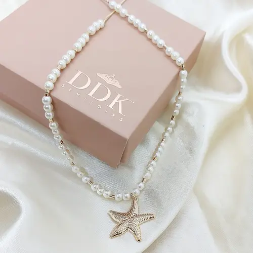 Choker estrela do mar banhado em ouro 18k.