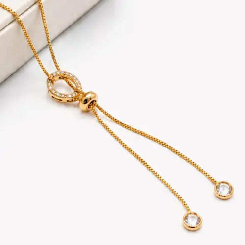 GRAVATA OVAL BANHADA A OURO 18K